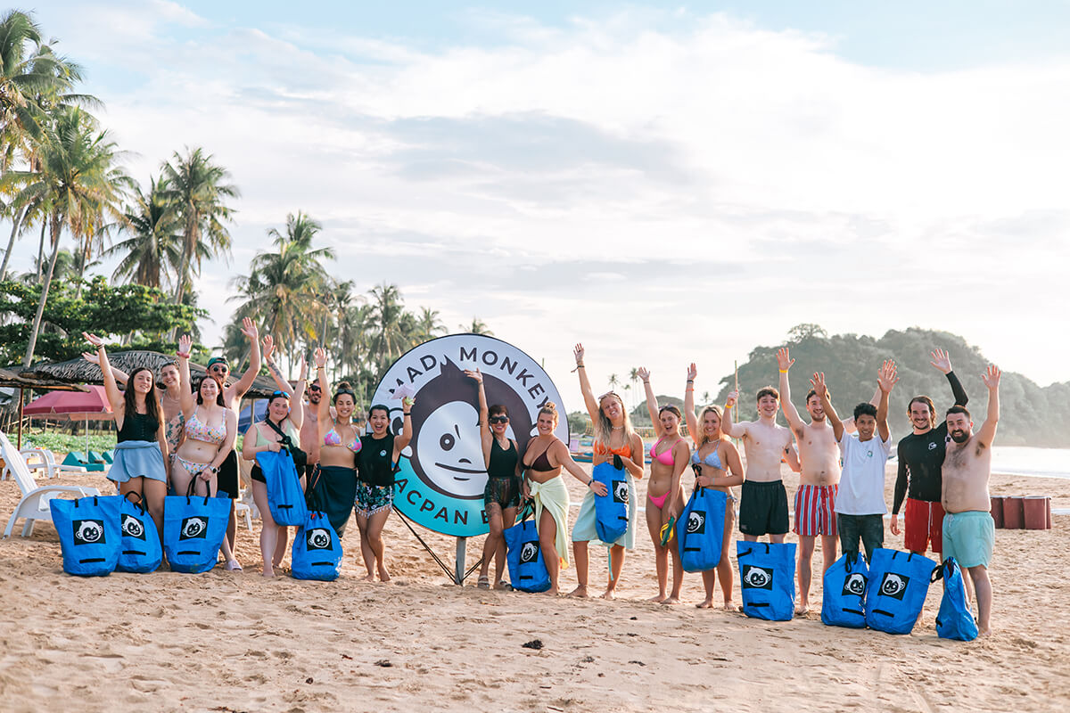 Mad Monkey guests participating in a beach cleanup at Nacpan Beach, El Nido..