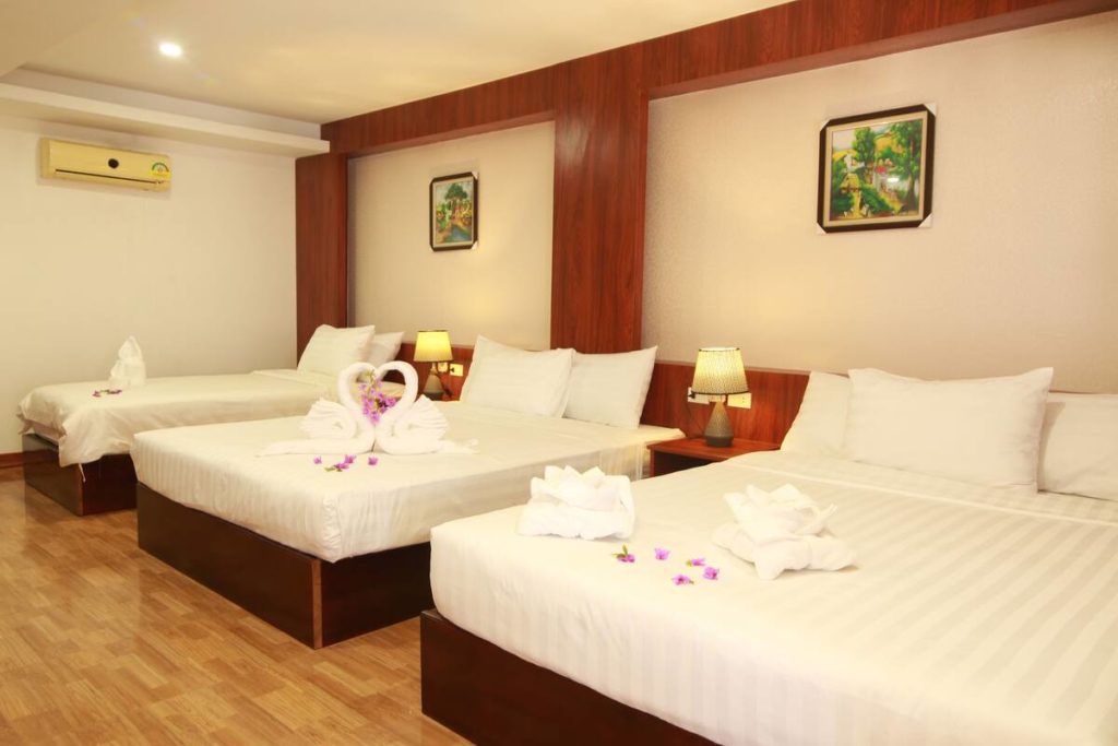 Large comfy beds at Victory Hotel - a great place to stay in Vang Vieng