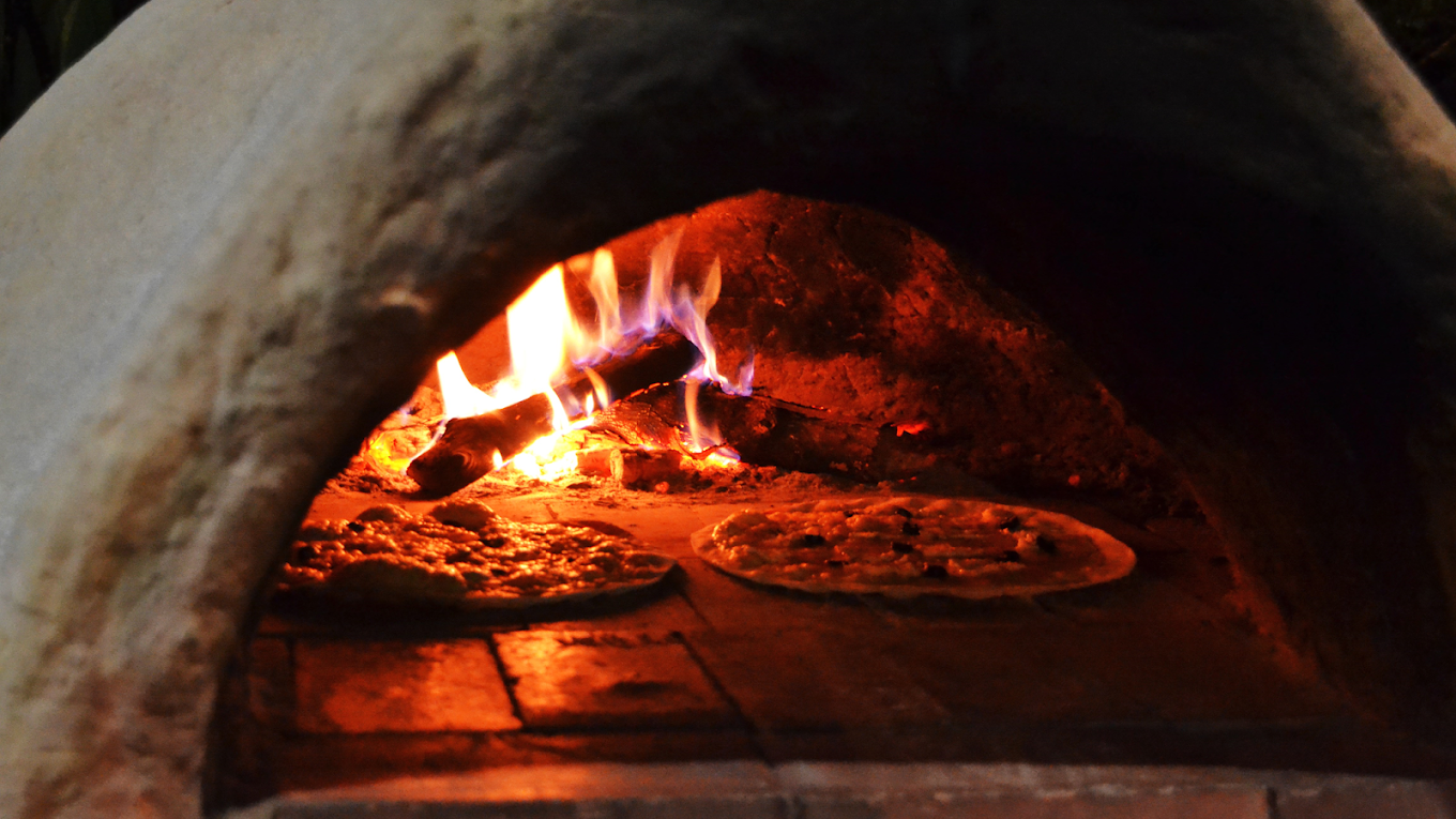 Wood-fired pizzas at Pizza Luka Vang Vieng