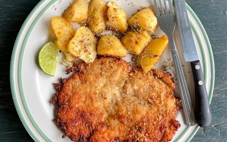 Viman Vang Vieng's schnitzel and fried potatoes dish
