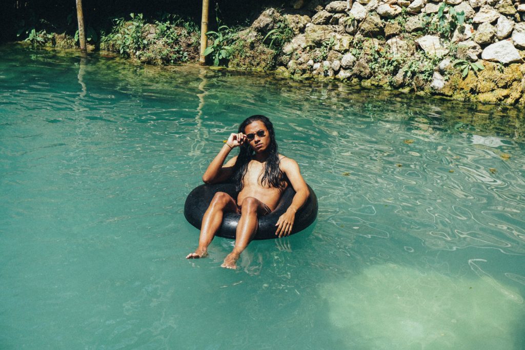 Man tubing on Nam Song River in Vang Vieng