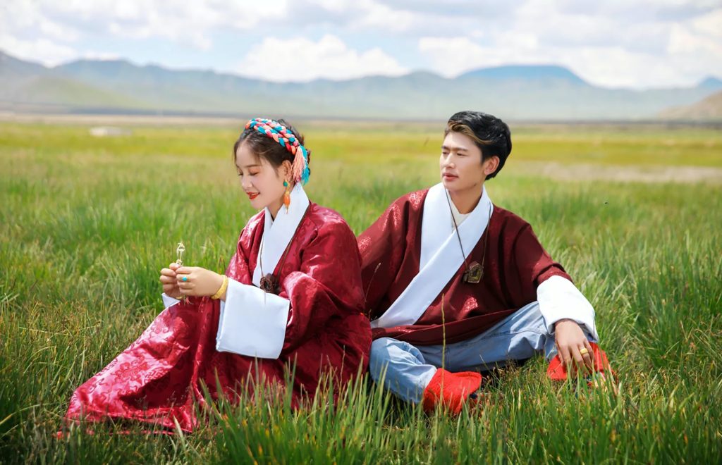 Laotians in traditional clothes on a field in Laos