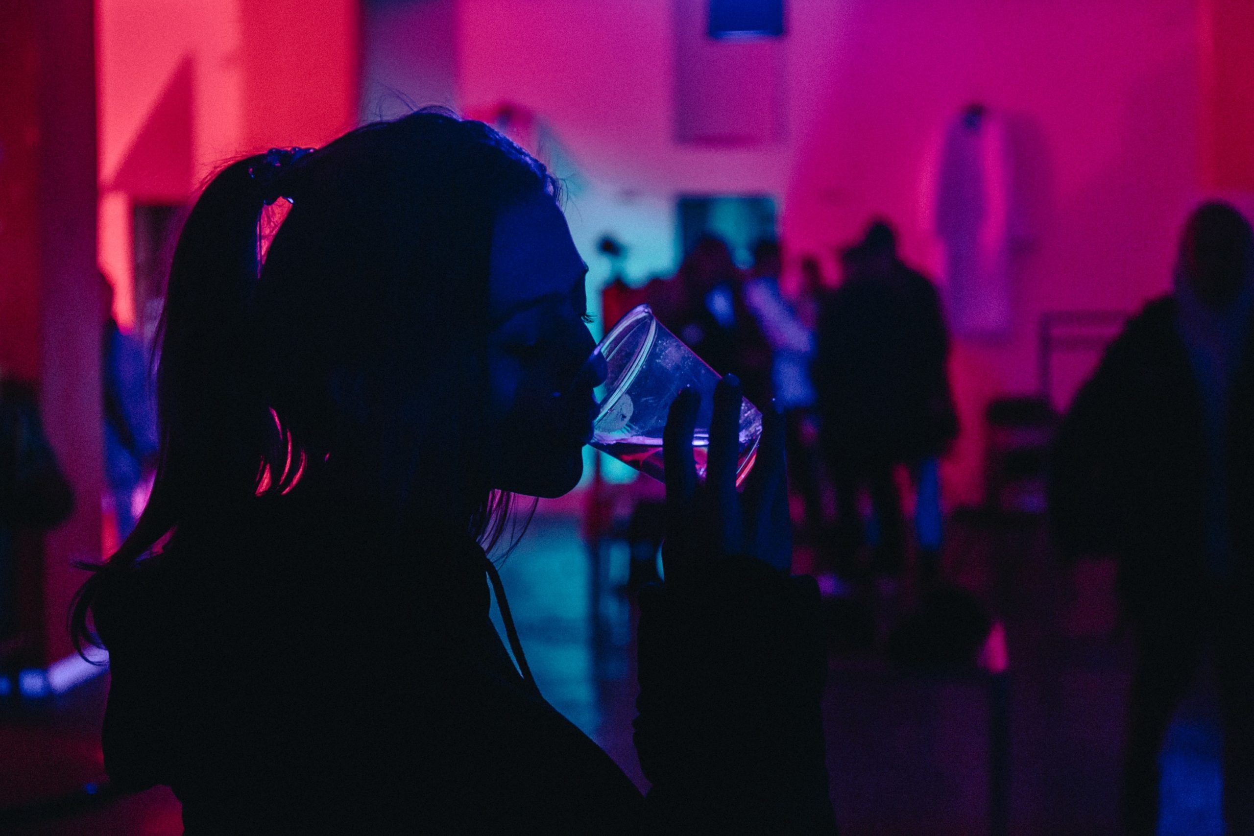 woman drinking at a bar or club
